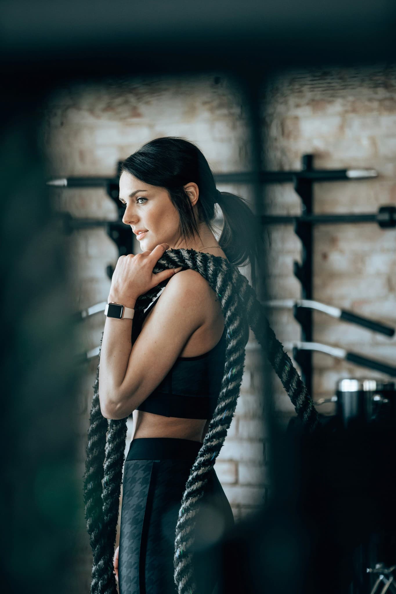 Woman training with a battle rope